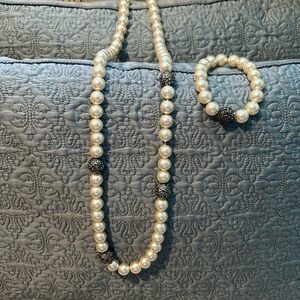 Costume jewelry, pearl necklace and matching bracelet.